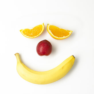 Smiley face built of fruits on white ground - SRSF000608