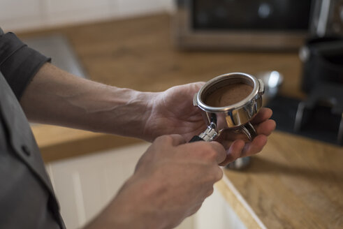 Preparing a cappuccino, coffee filter, pressed coffee powder in portafilter - PAF001563