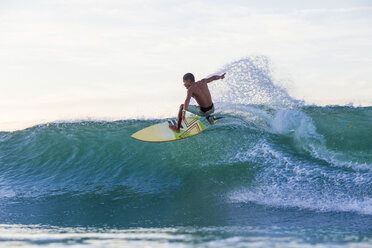 Indonesia, Lombok, Surfer on a wave - KNTF000247