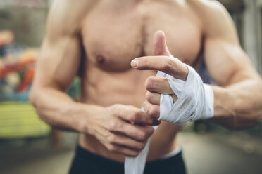 Boxer bandaging his hand - MADF000852