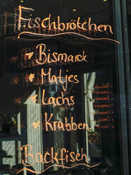 Germany, Hamburg, choice of a snack bar written on windowpane - HOHF001403