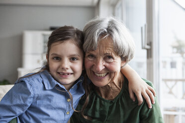 Portrait of happy grandmother and her granddaughter at home - RBF004216