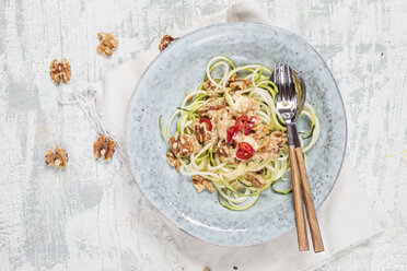 Spiralized zucchini and spicy walnut feta sauce on plate - SBDF002736