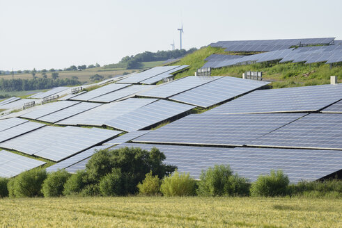 Germany, Bavaria, Franconia, Solar panels field in landscape - RUEF001653