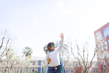 Little boy dressed up as a superhero posing on a meadow - VABF000350