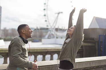 UK, London, two runners talking at riverwalk - BOYF000147