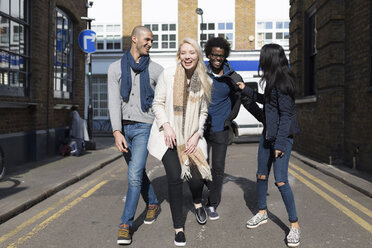 Group of friends having fun on urban street - BOYF000168