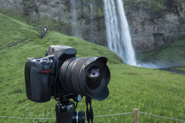 Iceland, DSLR camera in front of Seljalandsfoss waterfalll - PA001644