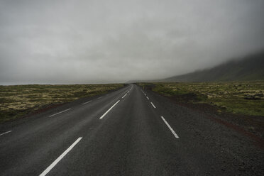 Iceland, empty road in fog - PAF001715