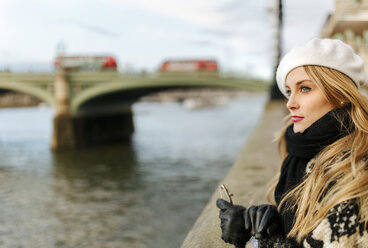 UK, London, young woman near Westminster Bridge - MGOF001561