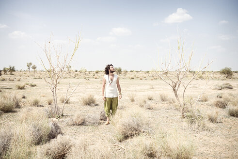 Man standing alone in the desert - BMAF000119