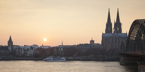 Germany, Cologne, view to the old town and Cologne Cathedral by sunset - WIF003290