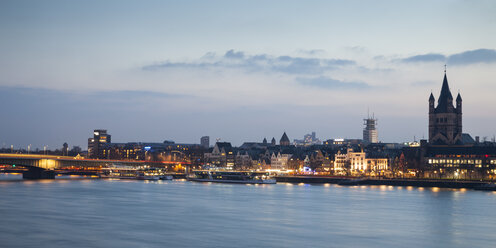 Germany, Cologne, view to the old town with Gross Sankt Martin at blue hour - WIF003291