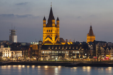 Germany, Cologne, view to the old town with Gross Sankt Martin and town hall at evening twilight - WIF003292