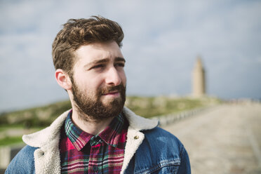 Spain, A Coruna, portrait of young man with brown hair and full beard - RAEF000943