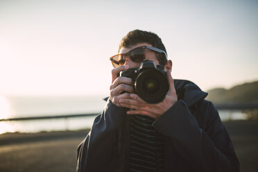 Man taking a photo of viewer - RAEF000952