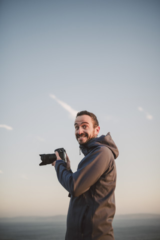 Portrait of a photographer with funny expression stock photo