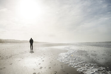 Denmark, Henne Strand, Person walking alone on the beach - BMA000169