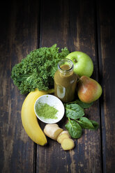 Ingredients for healthy vegetables and fruit smoothie on dark wood - CSF027366