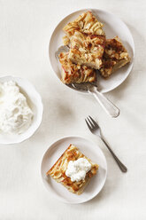 Whole meal apple pie with sliced almonds and whipped cream - EVGF002863