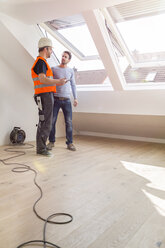 Construction worker discussing with building owner rebuilding of the apartment - SHKF000544