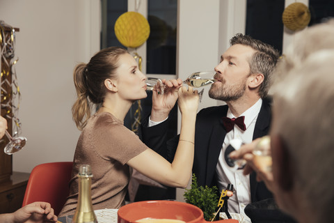 Couple drinking to close friendship on New Year's Eve stock photo