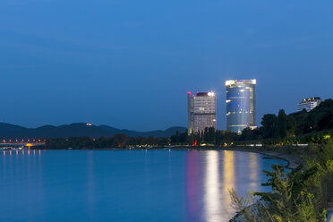 Germany, Bonn, view to Post Tower and UN Campus at blue hour - TAMF000451