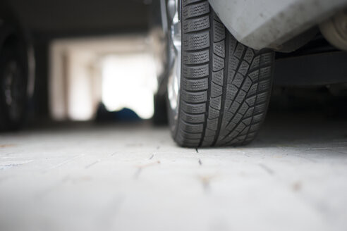 Germany, Car at underground car park, detail of tire - CHPF000225