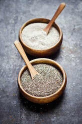 Wooden bowls of black and white chia seeds - CZF000244