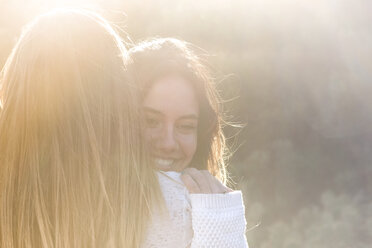 Two happy female friends at backlight - SIPF000316