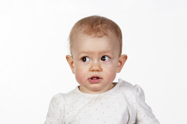 Portrait of baby girl in front of white background - WWF003936