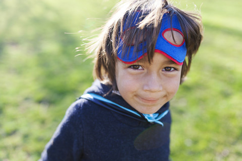 Portrait of little boy dressed up as superhero stock photo