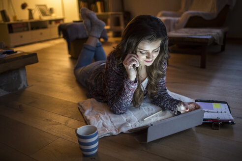 Young woman at home working with digital tablet - HAPF000297