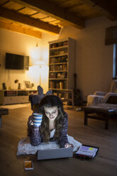 Young woman at home working with digital tablet - HAPF000298