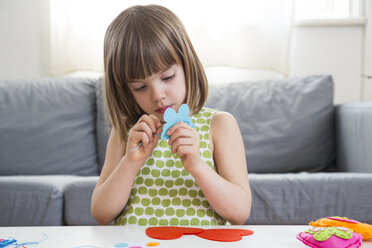 Portrait of embroidering little girl at home - LVF004699