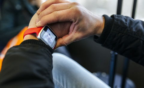 Man taking a selfie with his smartwatch stock photo
