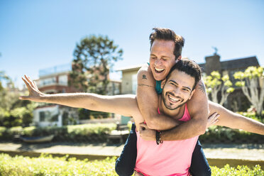 Los Angeles, Venice, portrait of happy gay couple with ice cream cone stock  photo