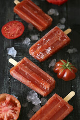 Tomato ice lollies on black wood - RTBF000091