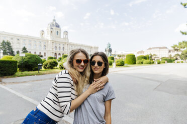 Austria, Vienna, two young women embracing at Museum of Art History - AIF000303