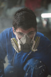 Portrait of a construction worker with protective mask - RAEF001041