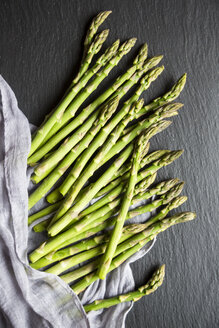 Mini organic green asparagus on slate - SARF002679