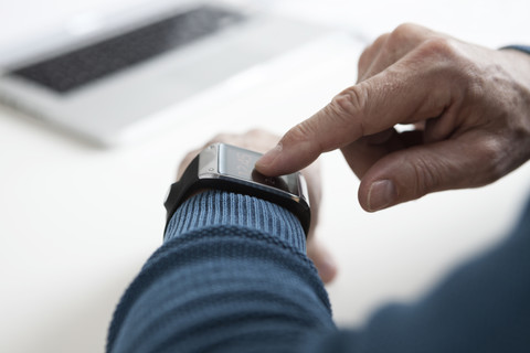 Smart watch on arm of mature man stock photo