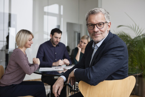 Business people having team meeting in office stock photo