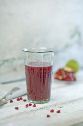 Glass of pomegranate smoothie - ASF005882