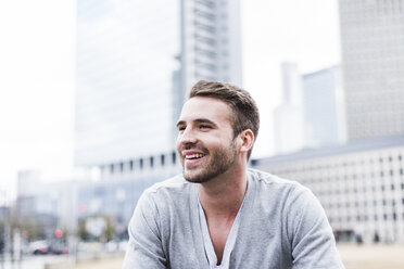 Young man laughing happily, portrait - UUF006862