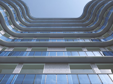 Facade of high-rise building seen from below, 3D Rendering stock photo