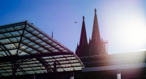 Germany, Cologne, view to church spires of Cologne Cathedral with glass roof in the foreground stock photo