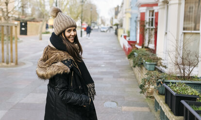 UK, London, Notting Hill, portrait of smiling young woman - MGOF001720