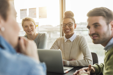 Colleagues in office having a meeting stock photo