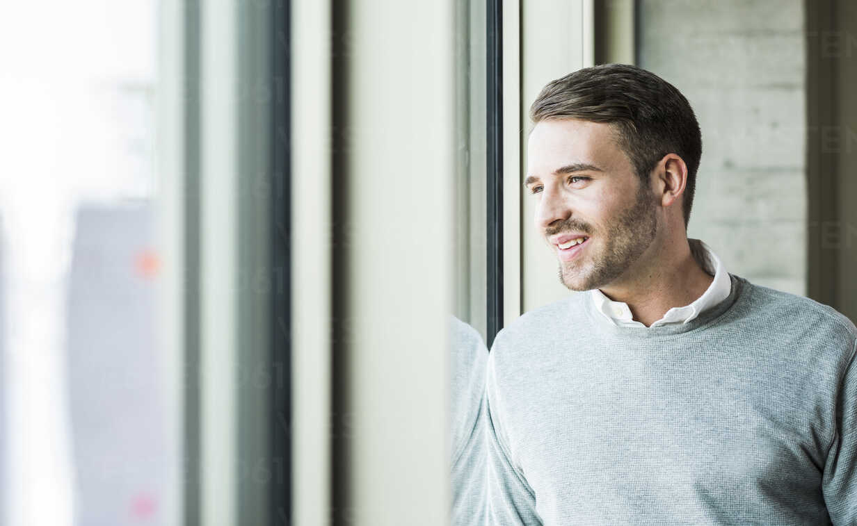 Young man at the window stock photo. Image of casual - 30207172